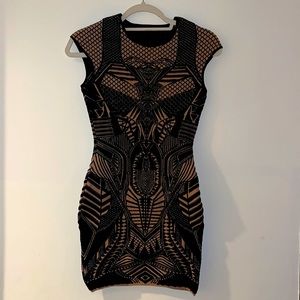 Short fitted black and beige evening dress